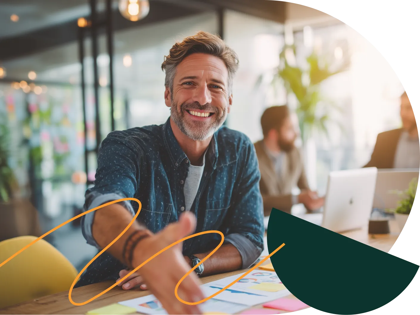 A smiling man in a meeting in an office – David Zelenka