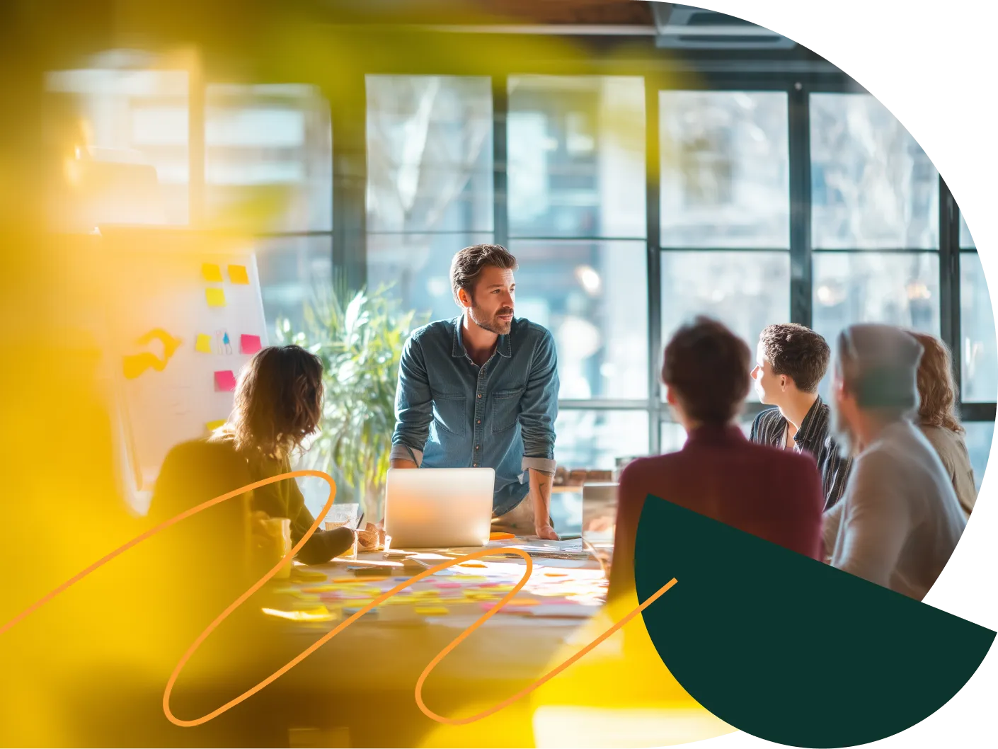 A group of people at a workshop, the facilitator standing by the table – David Zelenka